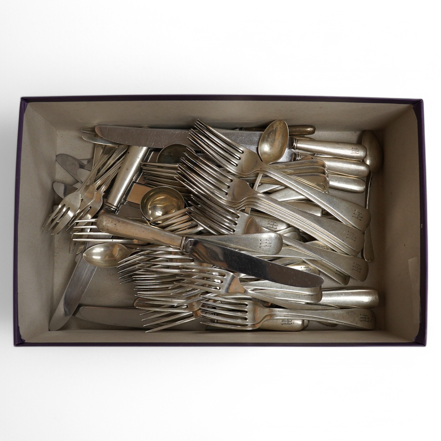 A part canteen of American sterling cutlery comprising thirty eight items, together with nine white metal handled dessert knives, nine table knives and six tea knives, all with engraved initial and a set of six silver pl